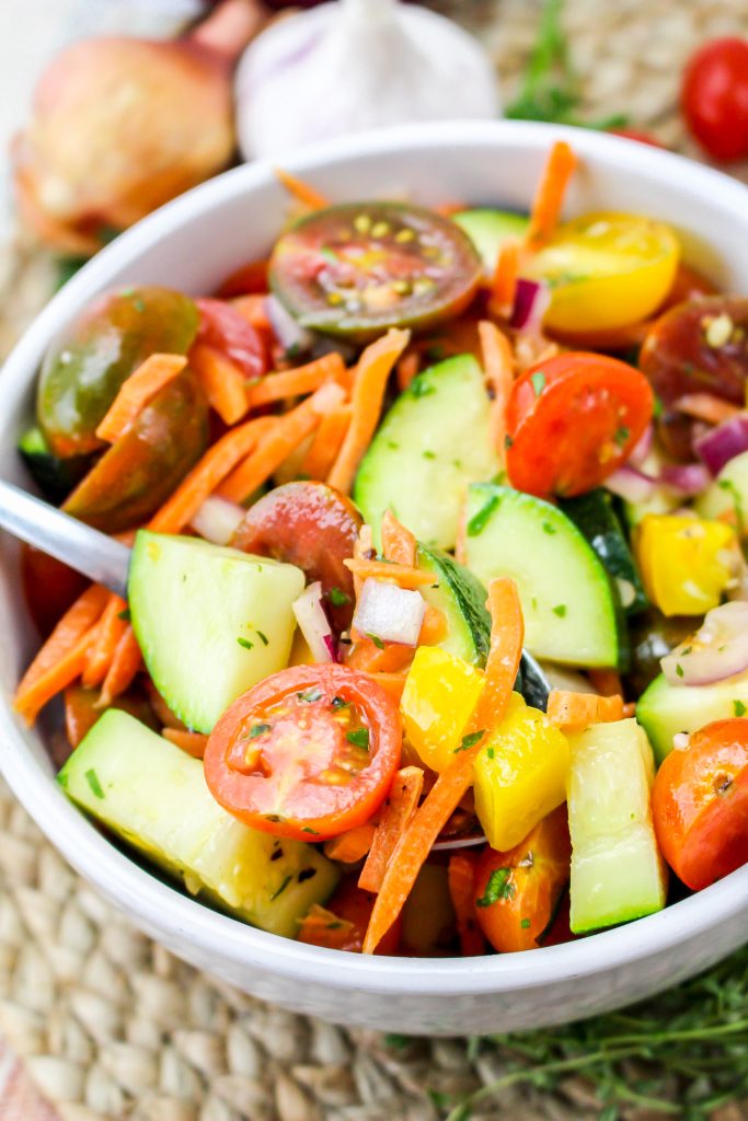 prepared salad with chunks of zucchini and tomato